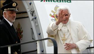 Pope Benedict waves as he boards his flight back to Rome.